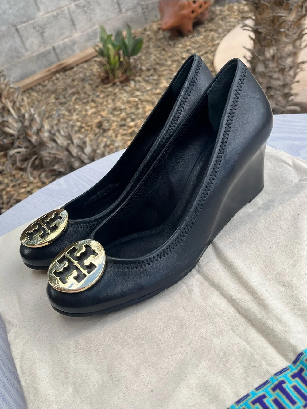 Tory Burch Sally Black Leather Wedge Pumps with Gold Medallion